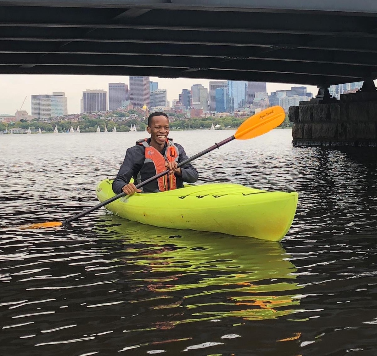 Felix Kitaka kayaking on the Charles River in Boston